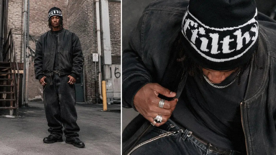 Black streetwear beanie with bold gothic text worn with a leather bomber jacket