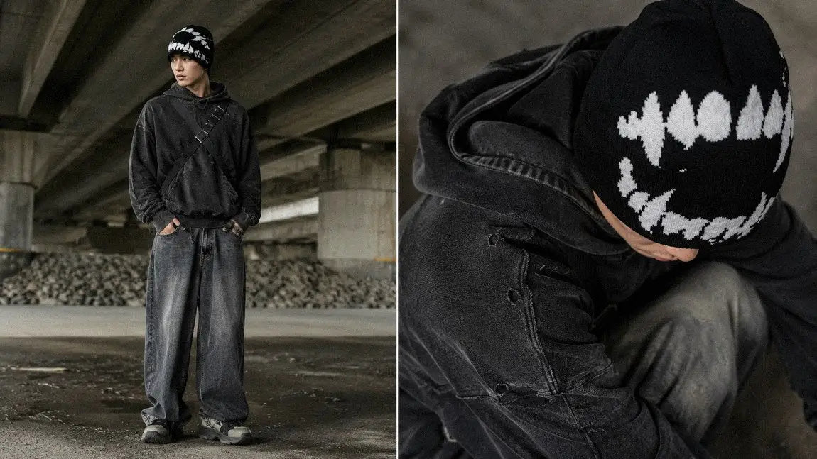 Fang-graphic streetwear beanie styled with a crossbody bag and wide wash jeans