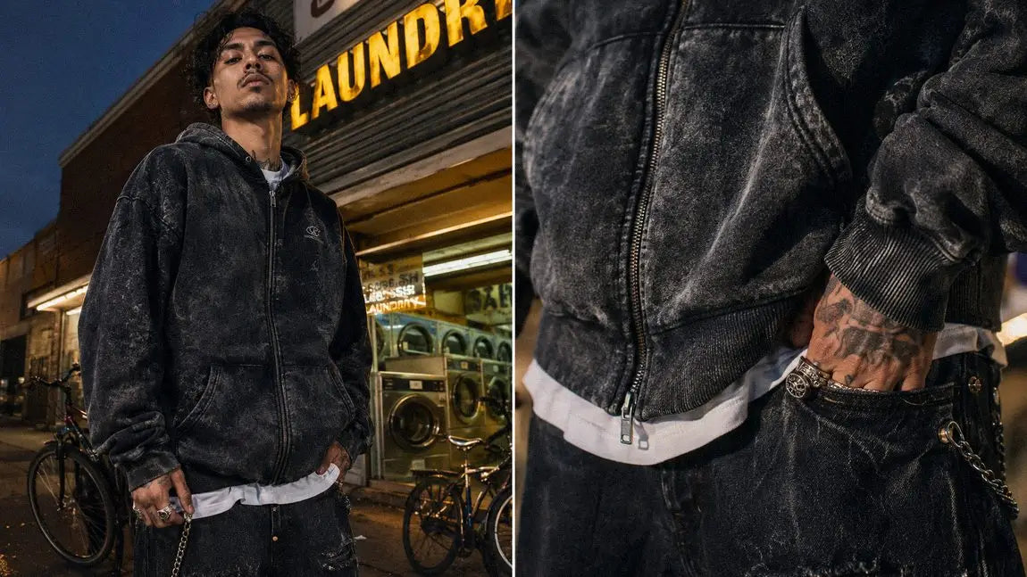 Acid-washed streetwear hoodie layered over a white tee outside a laundromat at dusk