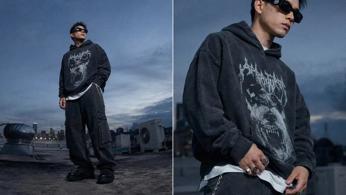 Oversized streetwear hoodie with a gothic wolf graphic shown against a rooftop skyline