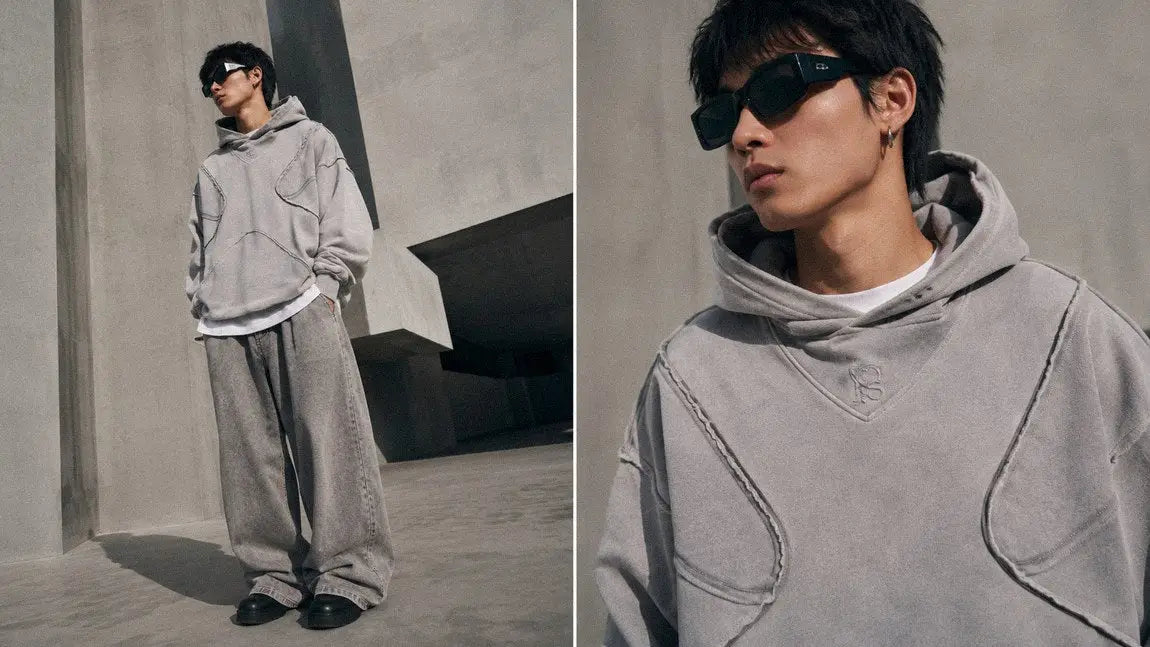 Light grey streetwear hoodie with raw seam paneling matched with wide sweatpants