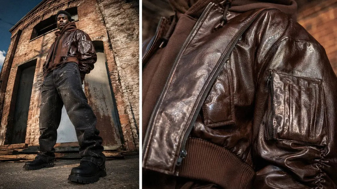 Cropped brown leather streetwear jacket styled over a hoodie with wide grey jeans