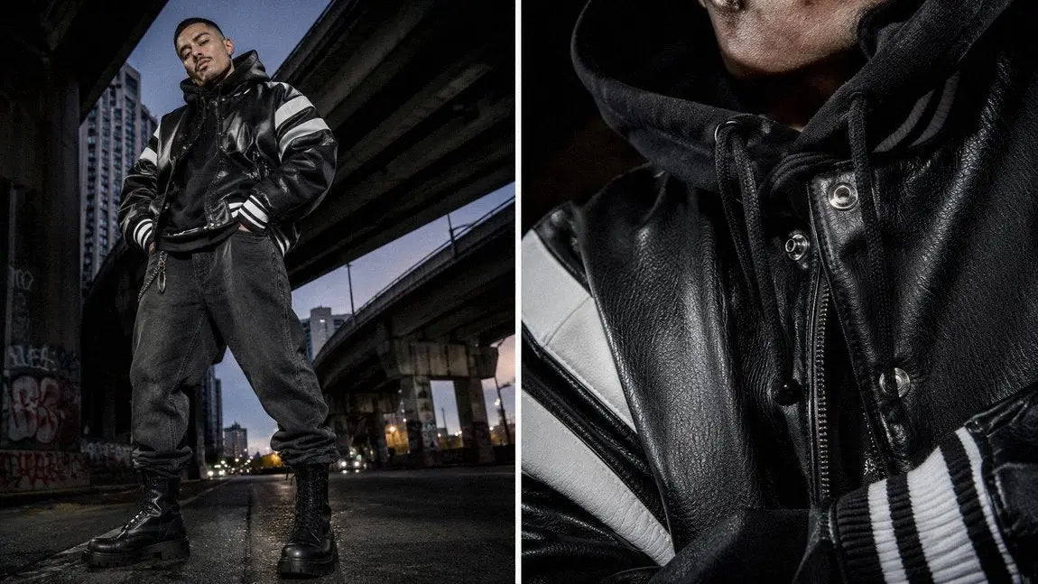 Racing-stripe leather streetwear jacket styled with a hoodie and black baggy jeans