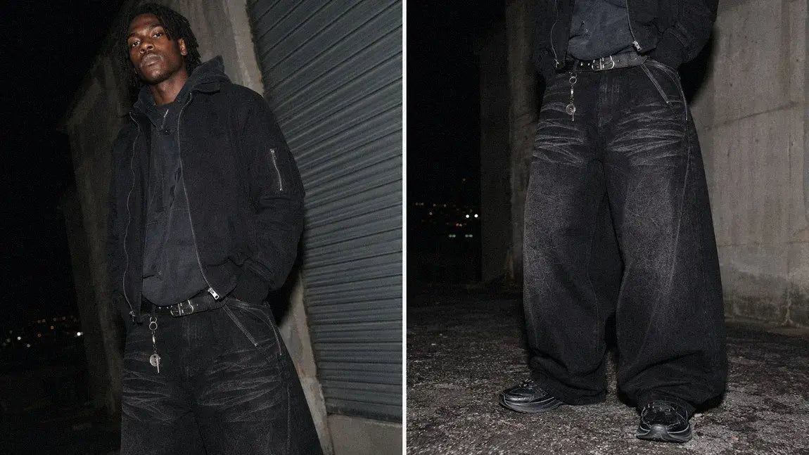 All-black streetwear jeans paired with a bomber jacket for a moody opium-inspired outfit