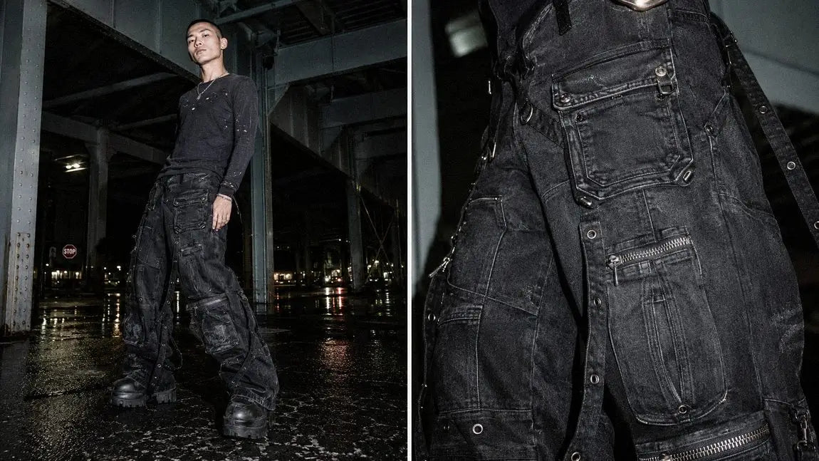 Black cargo streetwear jeans with heavy strap and zipper hardware under a bridge at night