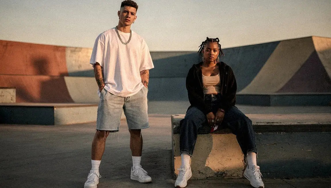 a white man and a black woman in streetwear jorts