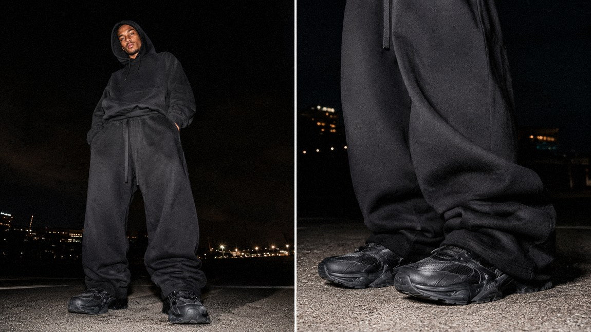 All-black streetwear pants paired with a matching hoodie for a moody opium-inspired look
