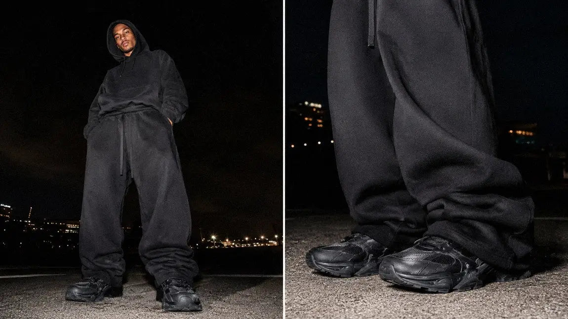All-black streetwear pants paired with a matching hoodie for a moody opium-inspired look