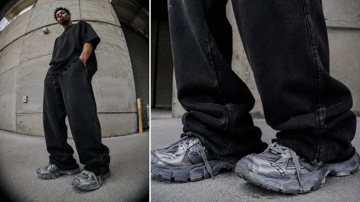 Relaxed black streetwear sweatpants creating an opium-inspired monochrome silhouette