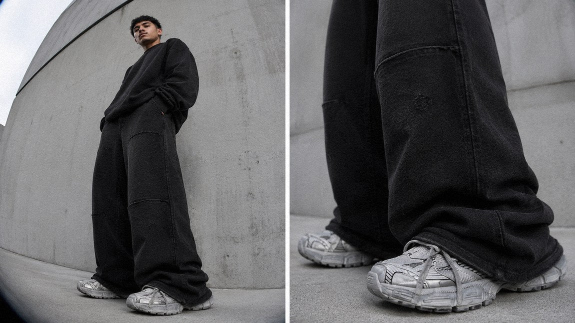 Wide-leg streetwear sweatpants with visible panel seams paired with an oversized crewneck