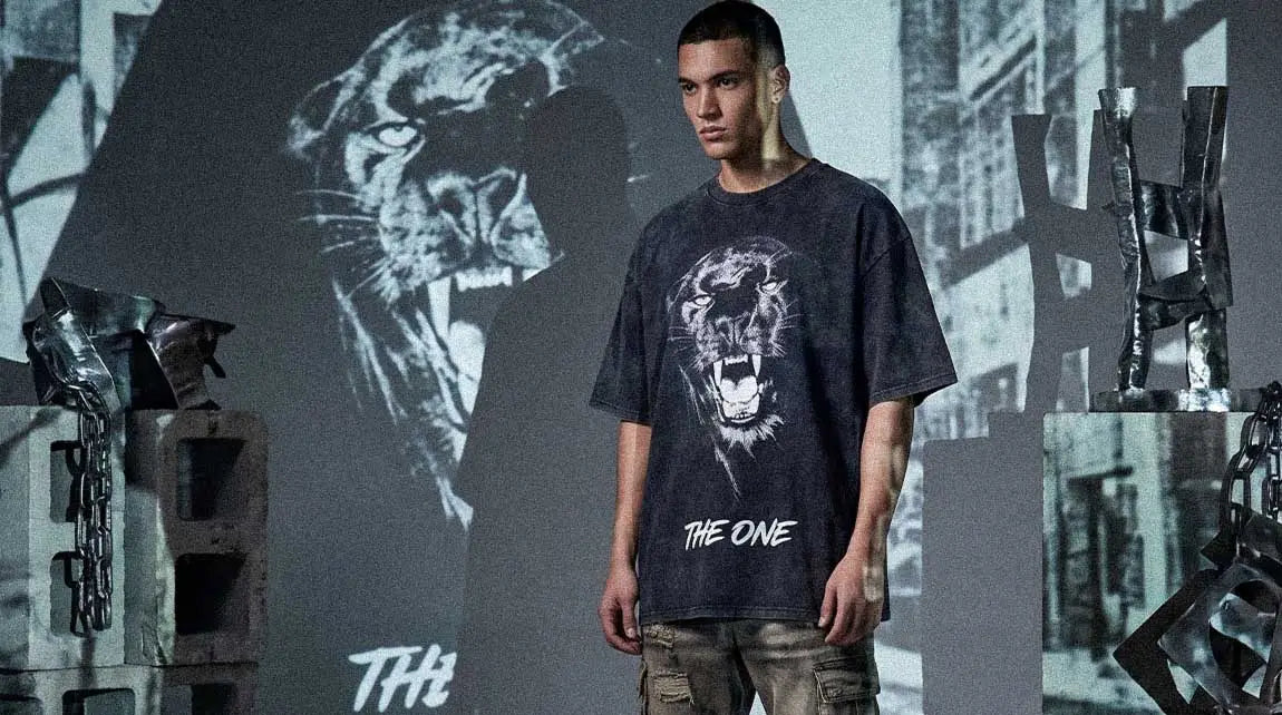This graphic Streetwear t-shirt features a roaring tiger design inside a dark industrial setting.