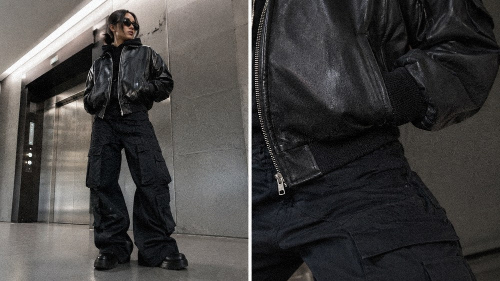 Cropped leather bomber jacket and cargo pants demonstrating cold-weather dark streetwear layering