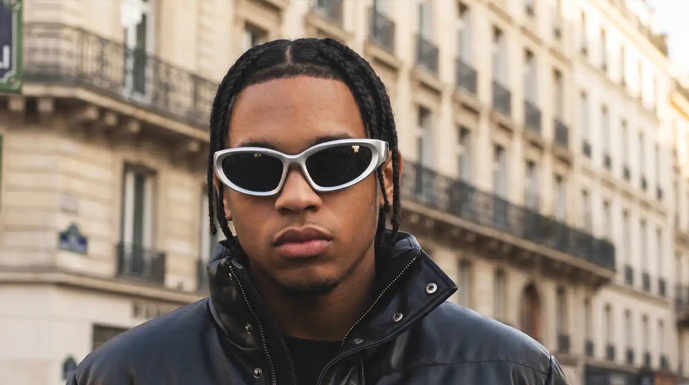 Man wearing streetwear sunglasses in an urban setting
